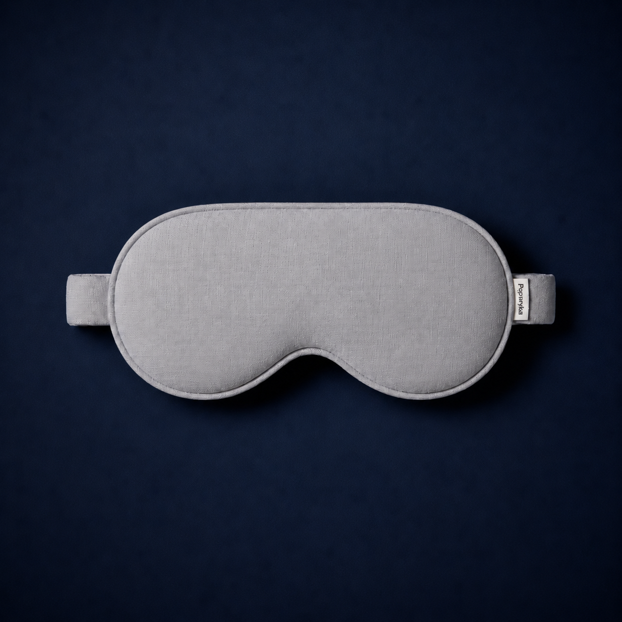 Silk Sleep Mask on dark surface